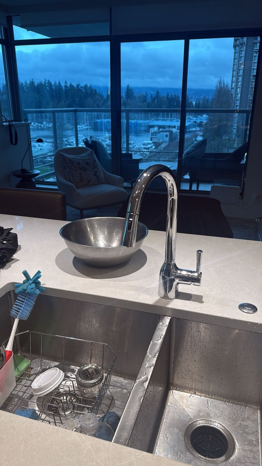 New chrome kitchen faucet installation in a downtown Vancouver condo