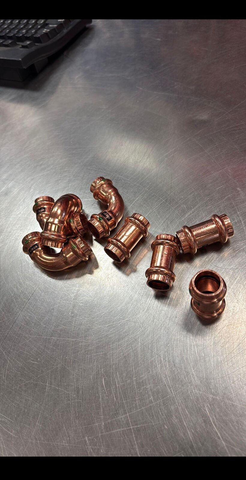 Copper press-fit fittings used for HYDROPRO water main connections in Vancouver