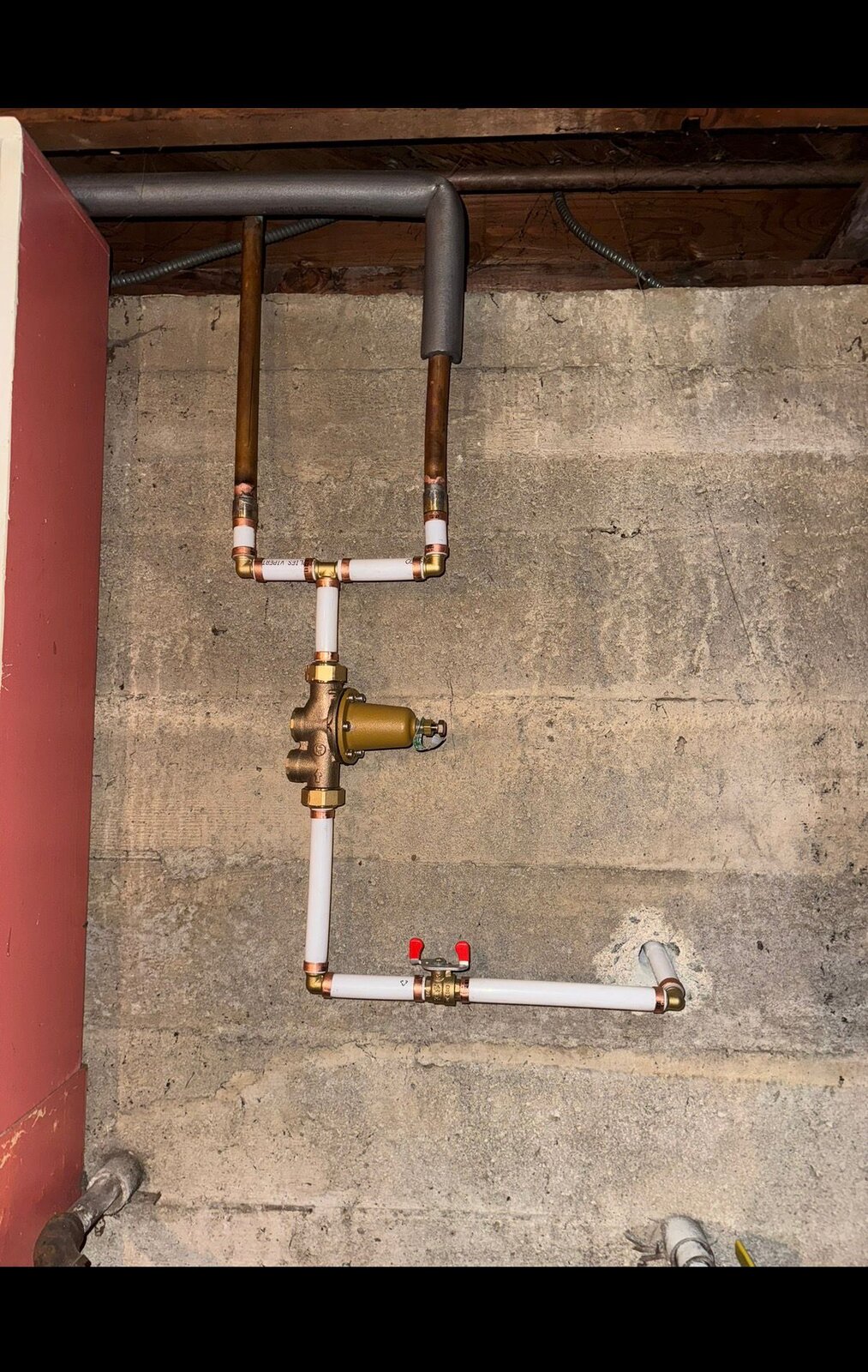 Completed PEX and copper water main installation with pressure reducing valve