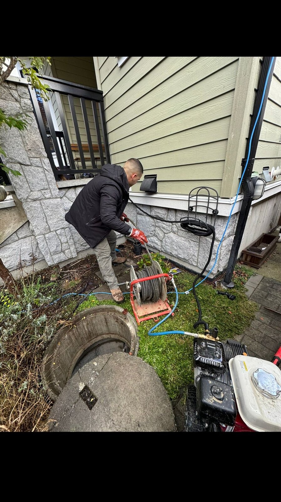 HYDROPRO plumber operating a sewer line hydro-jetter at a Burnaby property